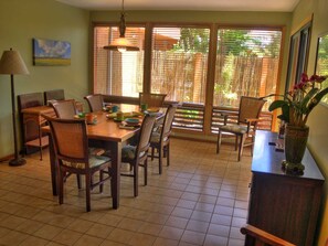 Solid hardwood dining table opens to seat  10 guests