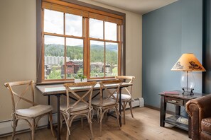 Custom dining table looks out over the Village below