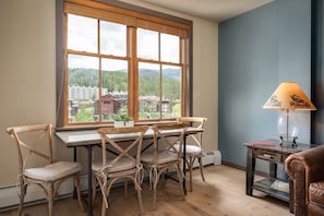 Custom dining table looks out over the Village below