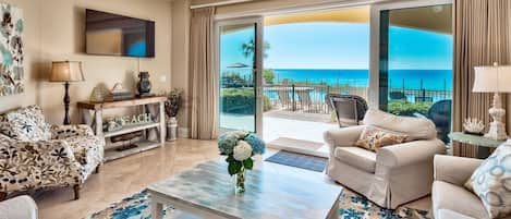 Sliding glass doors of B102 open to patio and pool. - Step from this 2200 square foot gulf front condo out to the pool (heated in cooler months) or take just a few steps to the beach walkover to enjoy Adagio's private beach.