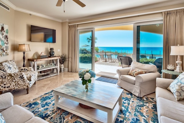 Sliding glass doors of B102 open to patio and pool. - Step from this 2200 square foot gulf front condo out to the pool (heated in cooler months) or take just a few steps to the beach walkover to enjoy Adagio's private beach.