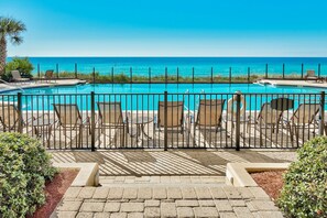 Your View from B102 Patio - Just steps to the gulf front pool and the beach walkover. Enjoy watching the children by day - and be assured that privacy rules say no swimming after 10 pm.