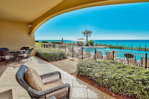 Adagio B102 patio overlooking pool and gulf. - Visit B102 and find out why it is one of YFAB's most popular gulf front condo! The patio is a great place to stash your floats and beach toys. And yes, we leave some there for you - so check it out!