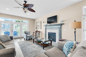 Living room with fireplace and flat screen TV