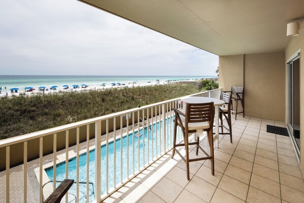 Large private balcony with pool and beach views