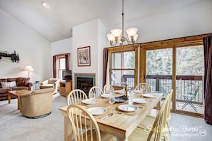 Dining Room - A table for 8 to enjoy serene mountain views while enjoying a hearty meal cooked in the fully stocked kitchen