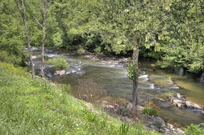 Relax to the sounds of the flowing river behind the cabin.