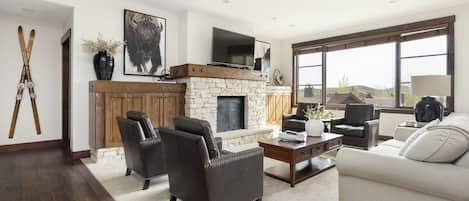 Comfortable Living Room with Contemporary Furnishings, a Gas Fireplace, Smart TV with DirecTv