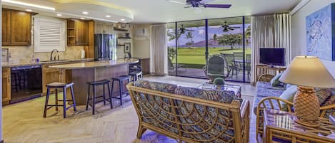 Great room with ocean front views - Interior and exterior space designed to maximize oceanfront location and views.  The double lanai doors bring the outside in.