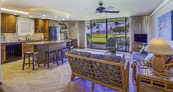 Great room with ocean front views - Interior and exterior space designed to maximize oceanfront location and views.  The double lanai doors bring the outside in.