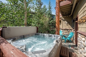Enjoy your bubbling private hot tub and outdoor seating