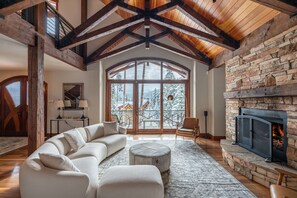 Bring the entire family together by the fire in the oversized main level living room