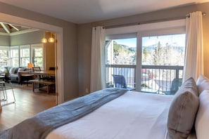 The guest bedroom is a beautiful space perfect for getting a restful night of sleep on the king size bed with gorgeous views out the sliding glass patio doors.