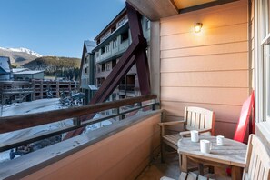 Private deck with seating for two and views of the Village
