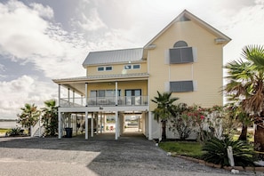 Welcome to The Pelican! - The Pelican is located at 106 Pass Drive in Gulf Shores just past the west beach pass bridge. This house is located on Little Lagoon and offers many great waterfront views, and an easy walk to the beach.