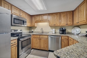 Updated, Fully Equipped Kitchen with Stainless Appliances and Granite Counter Tops