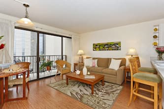 Secure one-bedroom with full kitchen, one parking and partial ocean views!