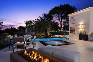 Fire pit, spa, pool, swim up bar, BBQ, plenty of seating