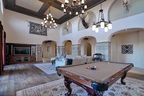 Pool table in 20ft ceiling living room.