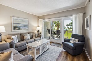 Living Room with Flat Screen TV and Private Balcony