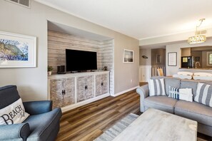 Living Room with Flat Screen TV and Private Balcony