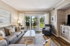 Living Room with Flat Screen TV and Private Balcony