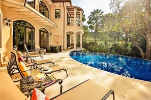 Pool area with lots of privacy, surrounded by rainforest. Enjoy the privacy of this home, you can hear the toucans, parrots and monkeys that some times visit the back yard.
