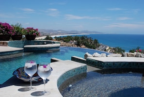 Jacuzzi and infinity pool overlooking ocean views