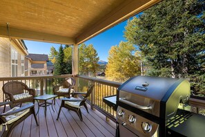 Take in the views from the main level deck with seating and a gas grill