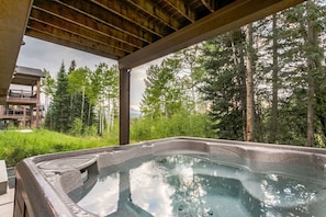 Private hot tub surrounded by pines and aspens