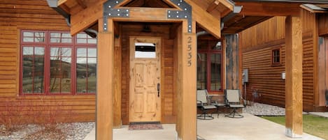 Front entrance to the Bridger Bungalow with a nice patio and barbecue grill.