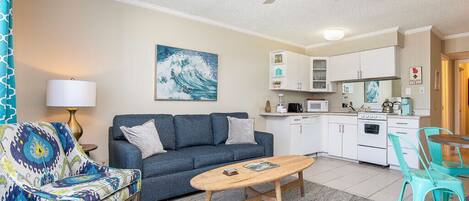 Living area with TV and balcony access