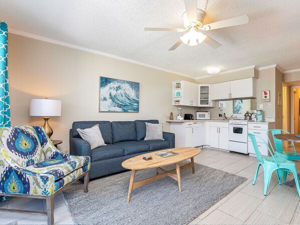 Living area with TV and balcony access