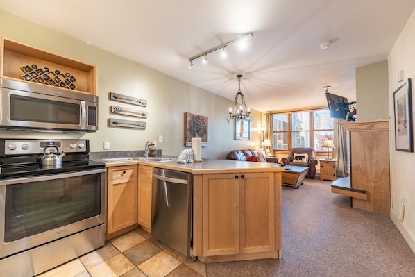 Updated full size kitchen with stainless steel appliances.