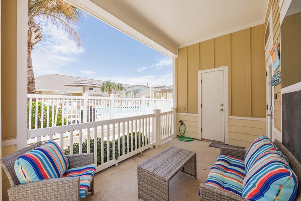 Savor the Texas breeze on your cozy private patio, just steps from the pool!