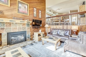 Living room with fireplace and flat screen television - Cedars 2 Breckenridge Vacation Rental