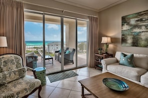 Sliding glass doors to a gulf front view - San Remo 409 is decorated to delight with a view that lets you see the dolphins swim by - and the paddle boarders, too!