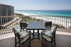 Private balcony with gulf front views and dining table