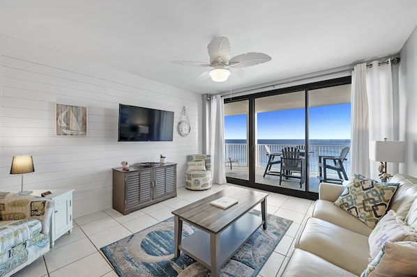 Living Room has access to Private Balcony overlooking the Gulf and has a new Queen Size Sleeper Sofa w/ state -of-the-art Memory Foam Mattress and a Comfortable Recliner