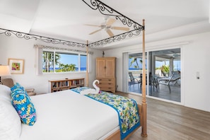 California King bed with ocean views and direct lanai/pool access.