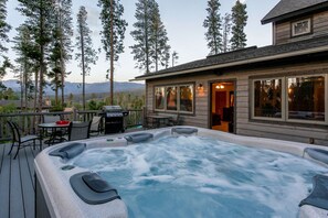 Enjoy the private hot tub all year round
