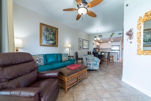 Paradise Harbor's open floor plan great room offers a queen size leather sleeper sofa, coordinating swivel chair, and leather recliner