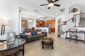 Living Area: Comfortable and inviting with a 50-inch flat-screen TV, wireless DVD player, and cozy seating