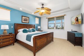 Upstairs retreat with a Cal King bed, flat-screen TV, sitting area, and private lanai.