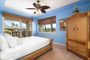 Bedroom with lanai, Large Bed, and Ceiling Fan