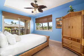 Bedroom with lanai, Large Bed, and Ceiling Fan