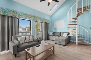A living area crafted for comfort with plenty of seating for the entire fam!