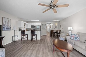 Living area looking into the kitchen/dining area! An open concept floor plan for all to gather!