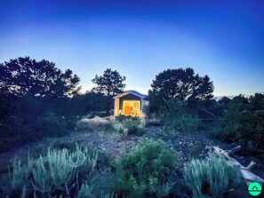 Tiny home Glamping unit at Night; Three (3) Glamping Cabins