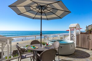 Private Beachfront Patio with a Spa